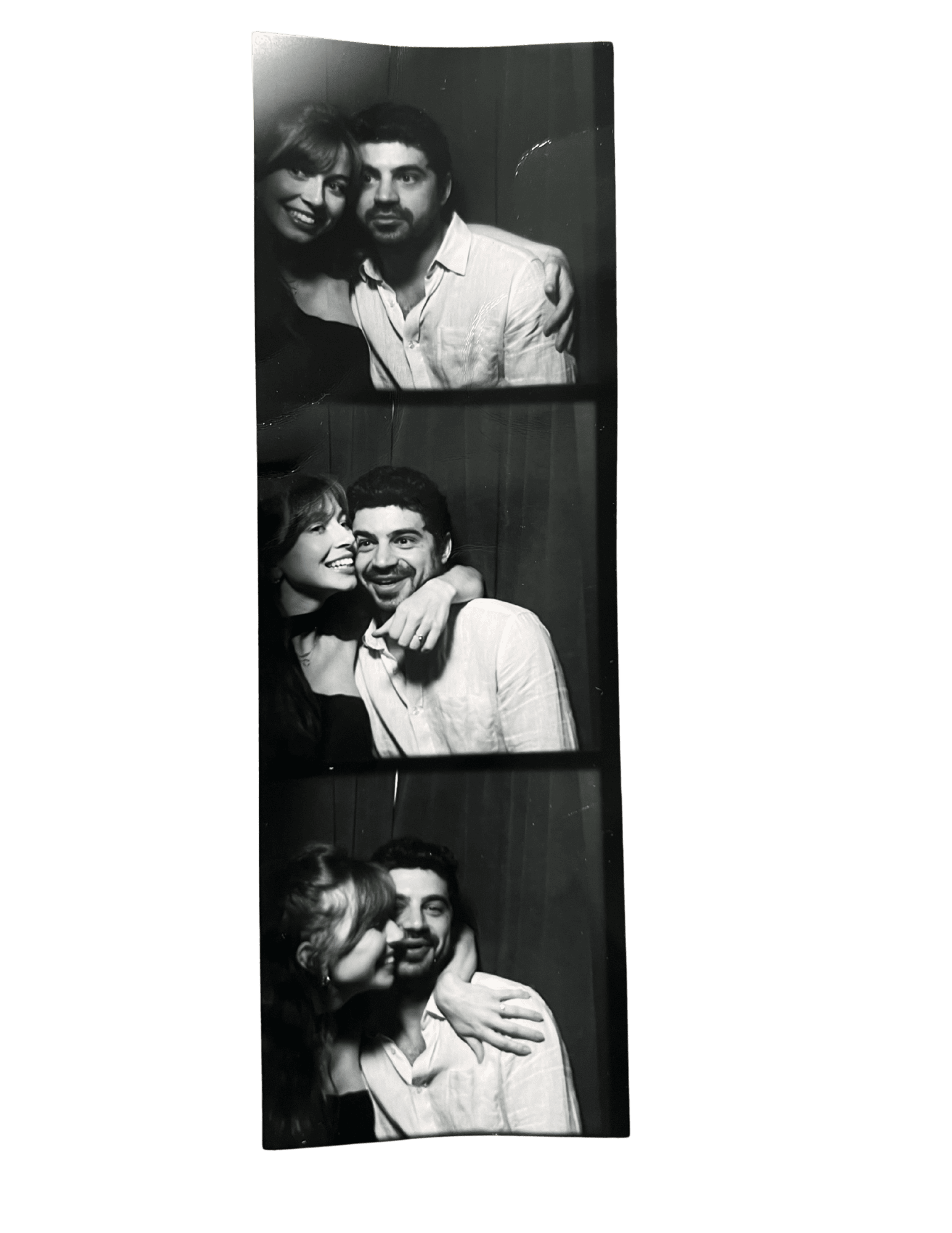 Black-and-white photobooth strip of the couple
